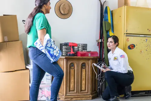 electrician speaking to customer about their whole home surge protector